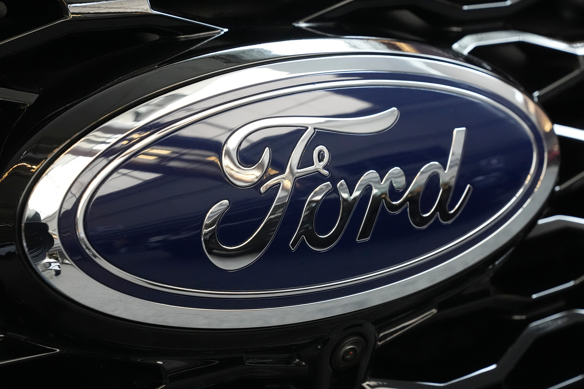 The Ford logo is seen on the grill of a Ford Explorer on display at the Pittsburgh International Auto Show, in Pittsburgh, on Feb. 15, 2024.