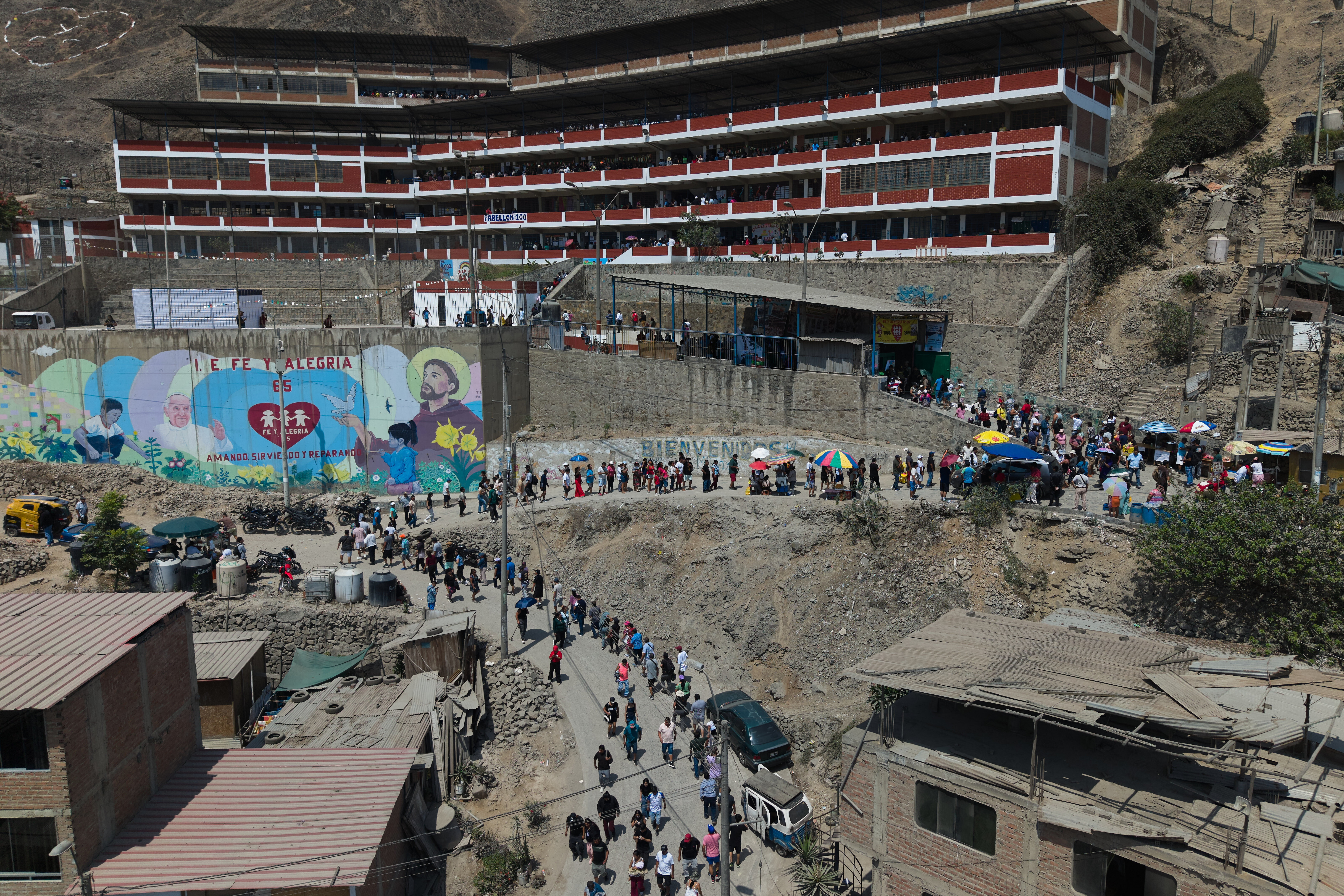 Voters line up outside a polling station during general elections in Lima, Peru, Sunday, April 12, 2026.