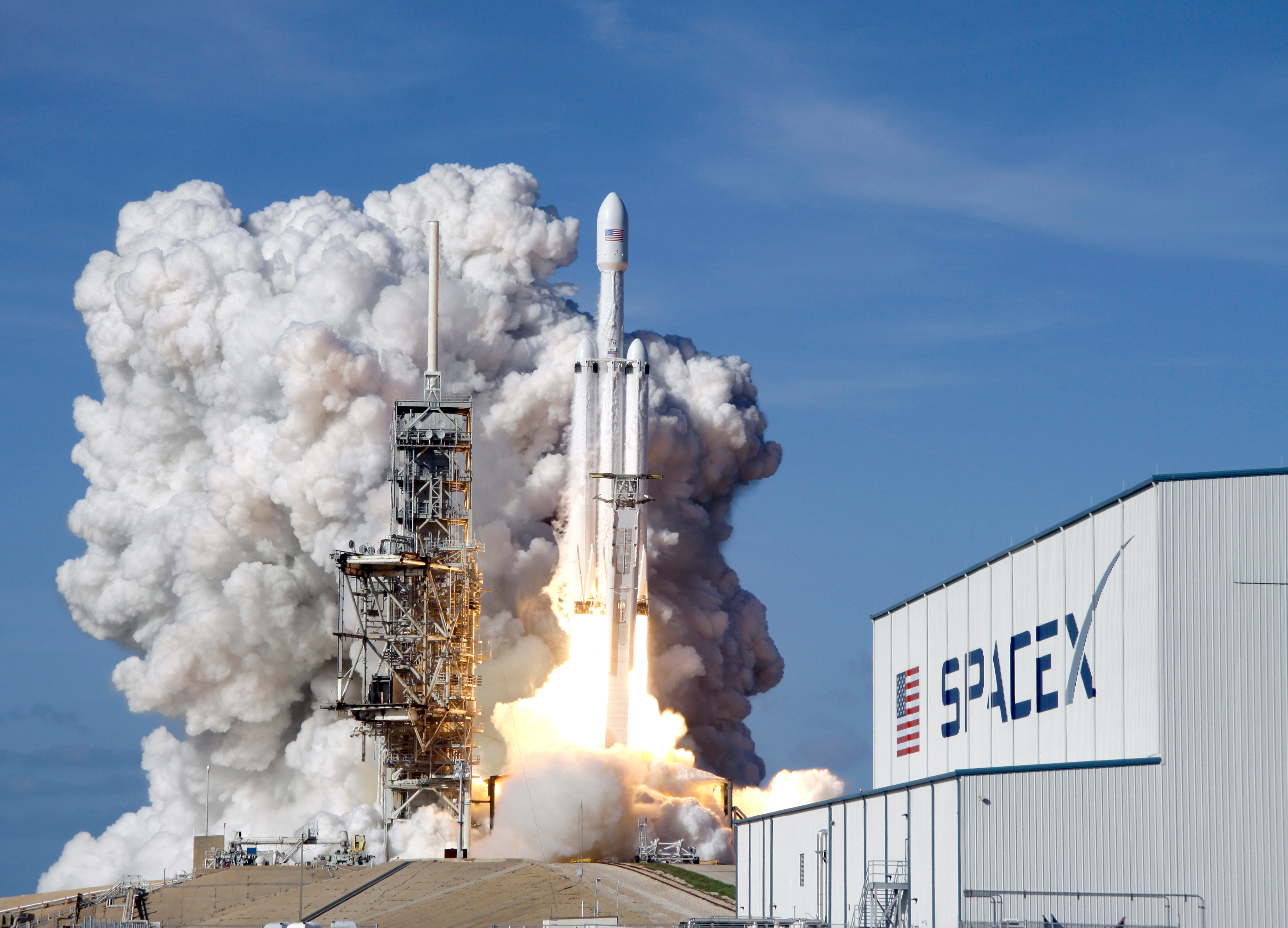 A Falcon 9 SpaceX heavy rocket lifts off from pad 39A at the Kennedy Space Center in Cape Canaveral, Fla., Tuesday, Feb. 6, 2018.