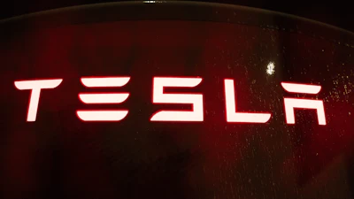 A Tesla electric vehicle charger is seen at a charging station on Wednesday, April 15, 2026, in Portland, Ore.