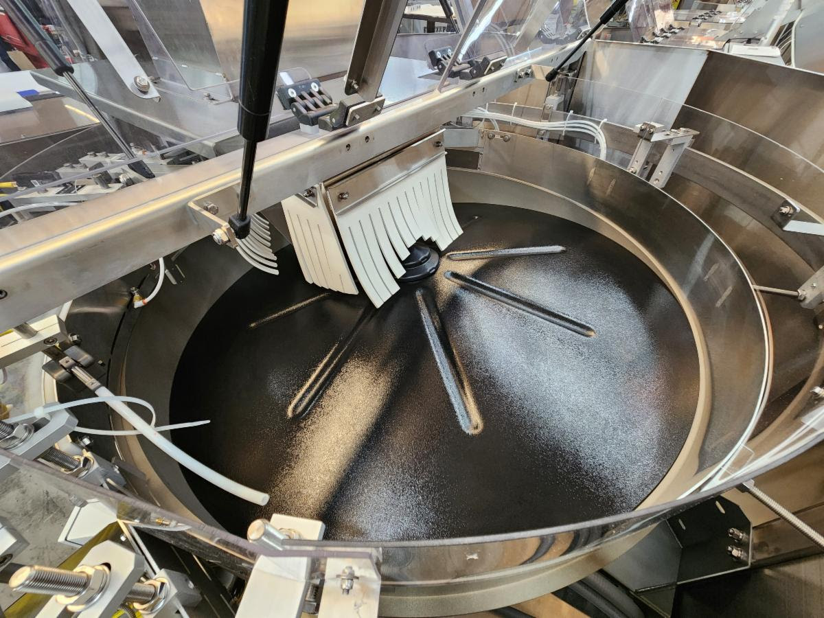 Commercial tilting skillet with stainless steel construction and cooking utensils in professional kitchen