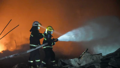 In this photo released by Xinhua News Agency, firefighters work to out the fire after an explosion at a fireworks plant in Guandu Town of Liuyang, central China's Hunan Province, in the early hours of May 5, 2026.