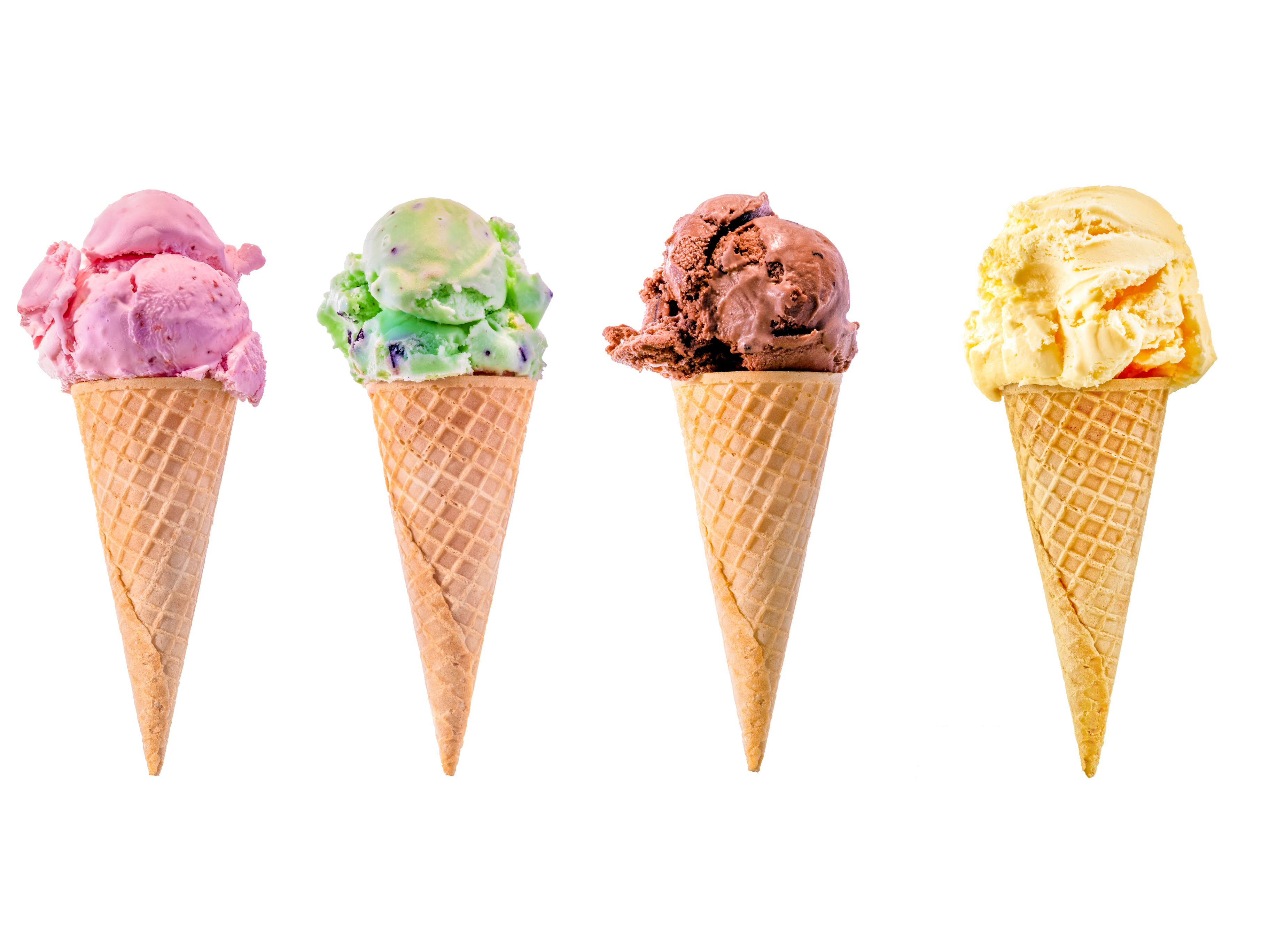 Four ice cream cones with pink, mint green, chocolate, and vanilla flavors in waffle cones