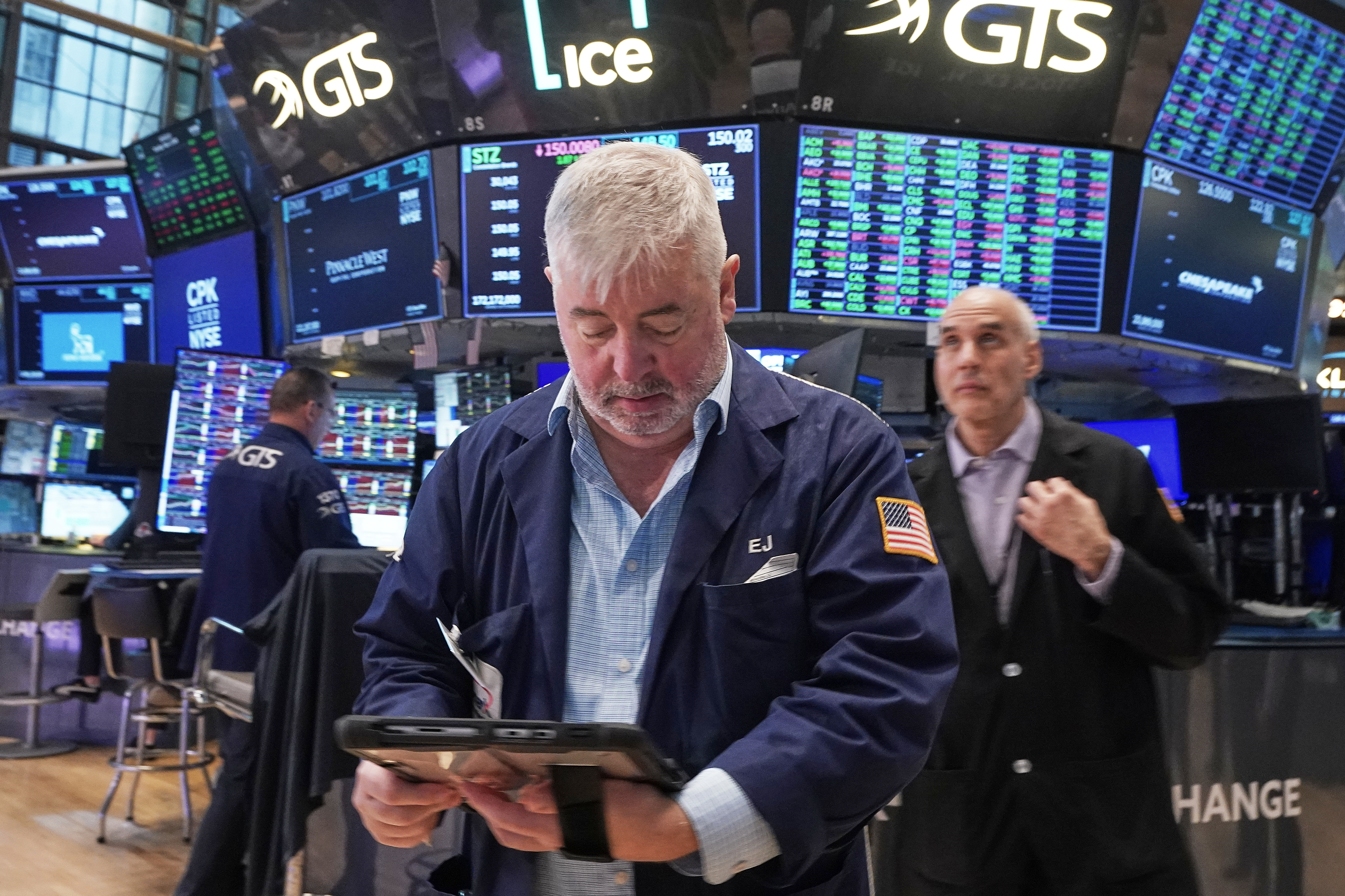 Trader Edward McCarthy, center, works on the floor of the New York Stock Exchange, Tuesday, May 5, 2026.