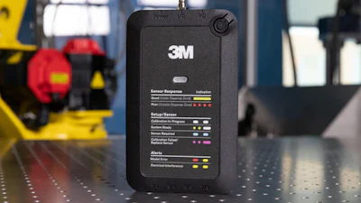3M sensor monitoring device with status indicators on laboratory workbench with industrial equipment
