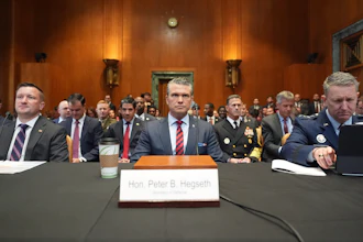 Acting Under Secretary of Defense and Comptroller Jules Hurst III, Defense Secretary Pete Hegseth and Chairman of the Joint Chiefs of Staff Gen. Dan Caine arrive to testify at a Senate Appropriations subcommittee on defense hearing on the budget request for the Department of Defense, Tuesday, May 12, 2026, in Washington.