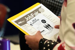 A job seeker waits to talk to a recruiter at a job fair, Aug. 28, 2025, Sunrise, Fla.