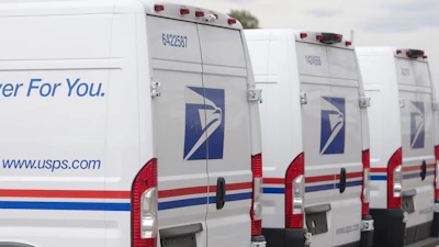 USPS delivery vans in Denver, March 23, 2026.