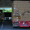 Workers transfer goods from a truck at the Xiaomi logistic center, Beijing, May 29, 2026.
