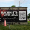 A hiring sign is seen outside of a company in Wheeling, Ill., Monday, June 8, 2026.