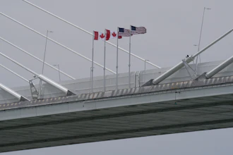 Canadian and American flags on the Gordie Howe Bridge between Windsor, Ontario and Detroit, May 22, 2026.