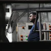 A worker stands in front of a fan on a hot day at Vinit Fabrics in Palsana near Surat, India, Tuesday, May 26, 2026.