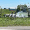 The wreckage of a plane crash burns in a field in Butler, Mo, Sunday, June 14, 2026.