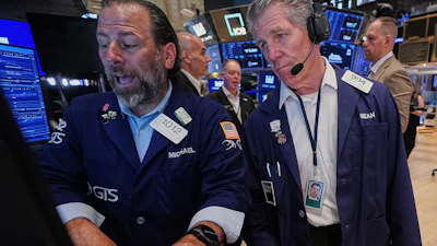 Specialist Michael Pistillo, left, and trader Sean Spain work on the floor of the New York Stock Exchange, Tuesday, June 16, 2026.