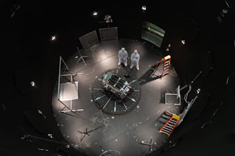 This photo provided by NASA shows Kieran Wilson, LINK’s principal investigator, and Hunter Robertson, a space systems engineer, both at Katalyst Space, standing next to their spacecraft inside the SES (Space Environment Simulator) at NASA’s Goddard Space Flight Center in Greenbelt, Md., April 17, 2026, ahead of thermal vacuum testing.