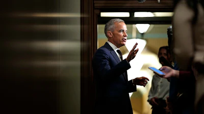 Canadian Prime Minister Mark Carney takes questions from journalists as he arrives on Parliament Hill in Ottawa, June 2, 2026.