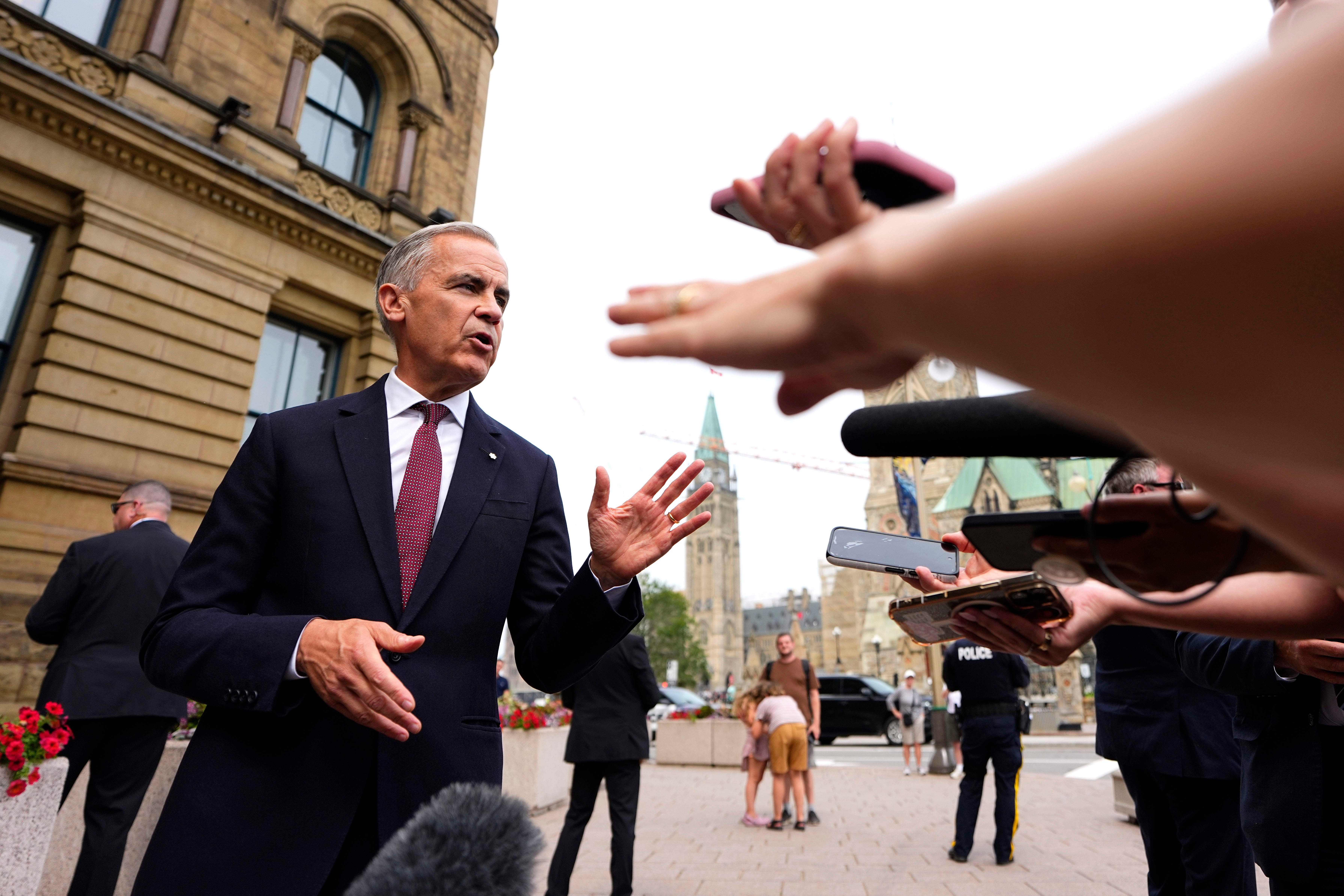Canada Prime Minister Mark Carney takes questions outside the Office of the Prime Minister and Privy Council in Ottawa, July 21, 2026.
