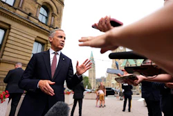 Canada Prime Minister Mark Carney takes questions outside the Office of the Prime Minister and Privy Council in Ottawa, July 21, 2026.