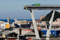 A vehicle sits short of a section of the Morandi highway bridge that collapsed on Aug. 15, 2018, in Genoa, northern Italy.