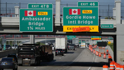Exits from Interstate 75 are displayed for the Gordie Howe International Bridge and Ambassador Bridge connecting Windsor, Ontario, with Detroit, Tuesday, July 14, 2026,