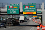 Exits from Interstate 75 are displayed for the Gordie Howe International Bridge and Ambassador Bridge connecting Windsor, Ontario, with Detroit, Tuesday, July 14, 2026,