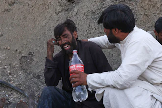 A man comforts a miner mourning fellow miners killed in an explosion at a coal mine on the outskirts of Quetta, in southwest Pakistan, Thursday, July 30, 2026.