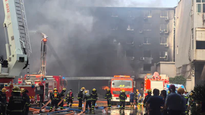 In this photo released by Xinhua News Agency, firefighters at the scene of a footwear factory fire in Jiangtou village, Chendai township of Jinjiang city, southeastern China's Fujian province, Thursday, July 9, 2026.