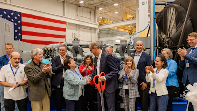 Jörg Stratmann, CEO of Rolls-Royce Power Systems, and Najwa Massad, Mayor of Mankato, at the opening of Rolls-Royce's new Logistics Operations Center in Mankato, USA. Representatives from politics, business, and the company were present for the official inauguration of the $24 million expansion.