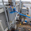 The Genie S-85 XC E in an extended welding application.