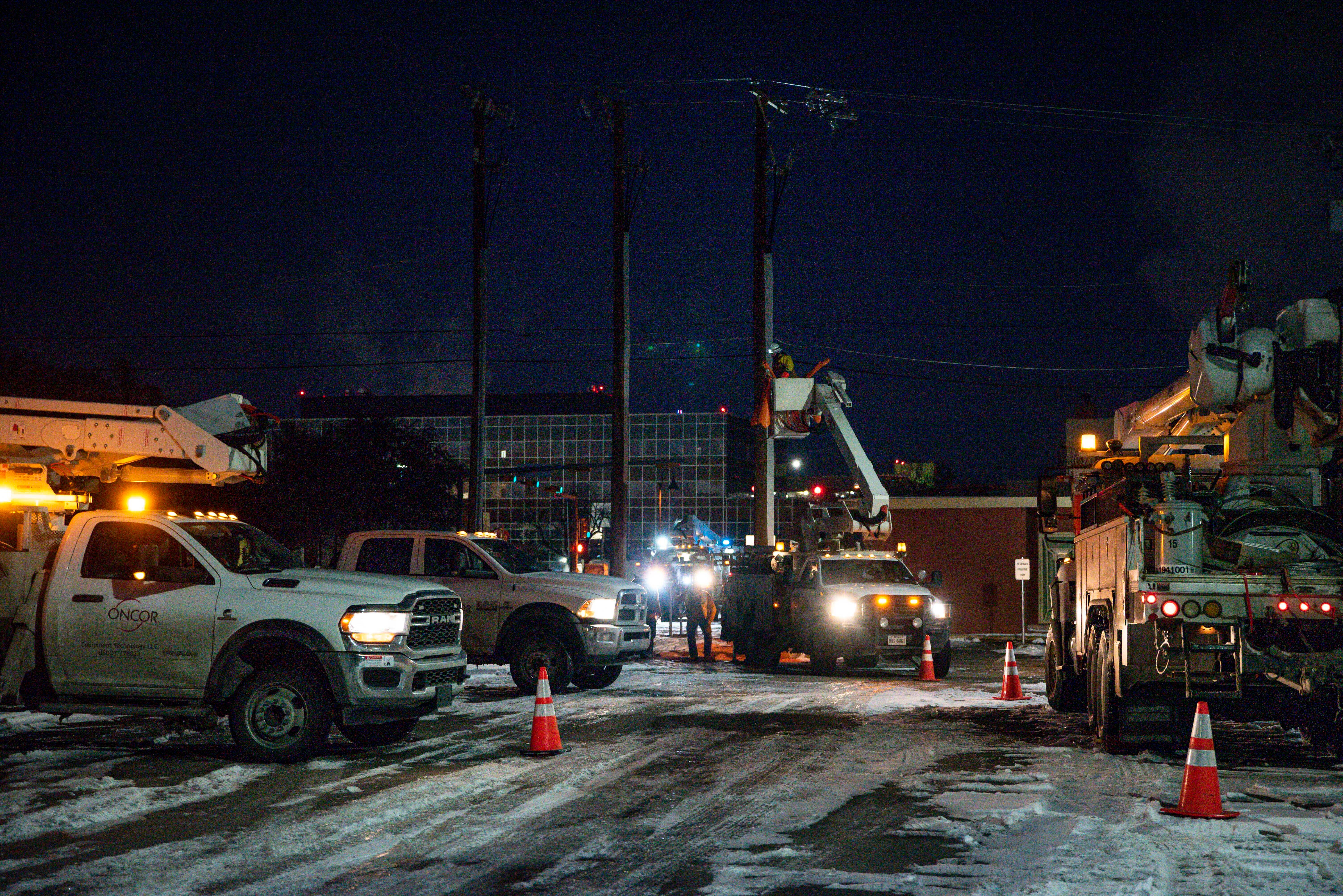 An Oncor Electric Delivery lineman crew work on repairing a utility pole that was damaged by the winter storm that passed through Odessa, Texas, Feb. 18, 2021.