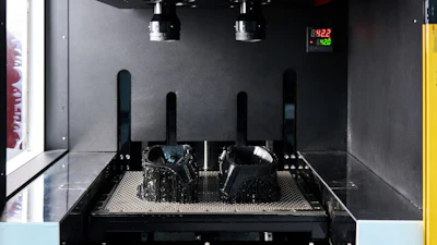 A vat photopolymerization process fabricates a component by curing liquid resin layer by layer using light.
