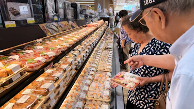 Customers at a grocery store in Arlington Heights, Ill., July 6, 2026.