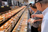 Customers at a grocery store in Arlington Heights, Ill., July 6, 2026.
