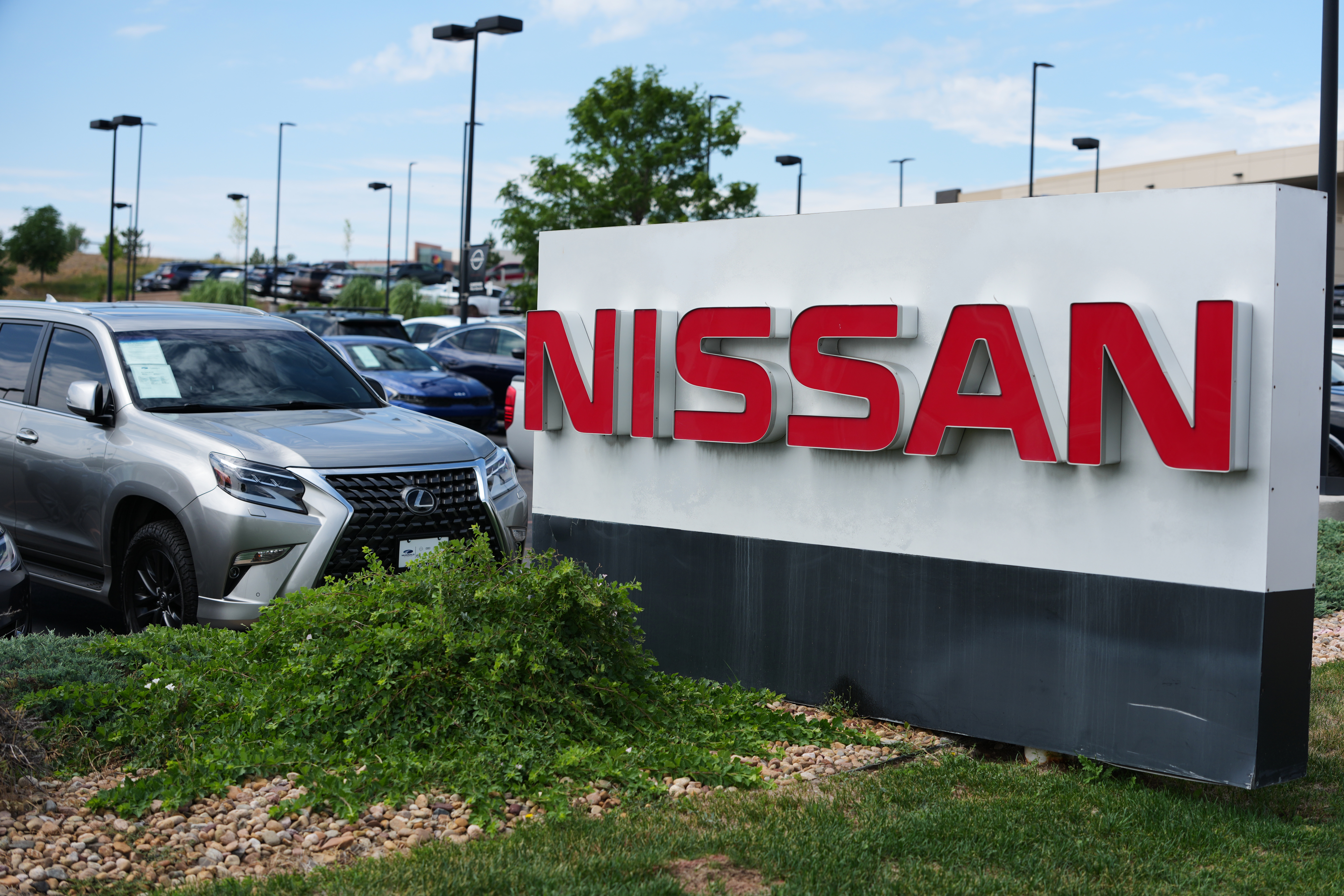 Sign carrying the corporate logo stands outside a Nissan dealership Monday, July 27, 2026, in Highlands Ranch, Colo.