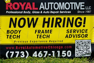 A now hiring sign is seen in front of an auto body shop in Chicago, June 25, 2026.