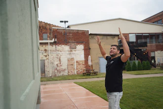Wesley Mast, owner and president of Coppes Napanee, gestures next to a giant replica of a Hoosier cabinet (see below) in Nappanee, Ind., Thursday, Aug. 6, 2026.