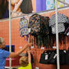 Shoppers look at backpacks at a Target store, Aug. 13, 2026, Woodbury, Minn.