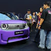 Visitors examine a Honda Super-One EV during the Indonesia International Auto Show organized by the Association of Indonesian Automotive Industries (GAIKINDO) in Tangerang, Indonesia, Thursday, July 30, 2026.