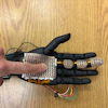 A robotic hand fitted with 3D-printed sensor module developed by the research team from Washington State University. The electronic skin can detect pressure and temperature at a fine level, laying the groundwork for bionic skin that could be used on prosthetics to help amputees and others.