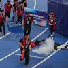 Officials extinguish a fire of a Humanoid robot after hitting the barrier at the end of the 100 meter final race during the World Humanoid Robot Games in Beijing, Wednesday, Aug. 26, 2026.