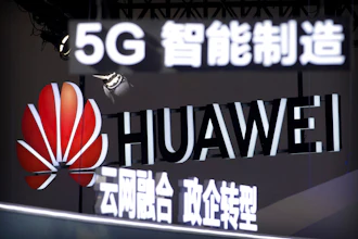 Signs promoting 5G wireless technology from Chinese technology firm Huawei are displayed at the PT Expo in Beijing on Sept. 26, 2018.
