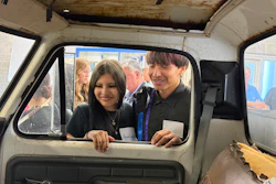 Students from Flandreau Indian School in South Dakota inspect a 1976 Ford F-350 utility truck.