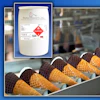 Madison Chemical Co. ICY CLEAN XX industrial cleaning product drum with hazard label displayed above food production conveyor line with waffle cones