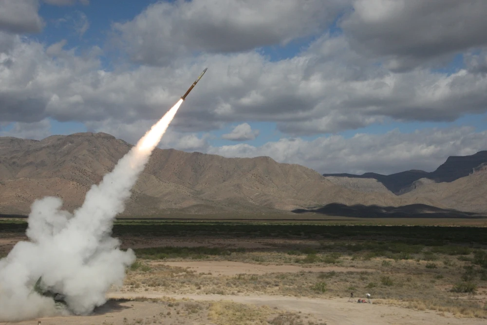 A Northrop Grumman-built solid rocket motor powering a Guided Multiple Launch Rocket System (GMLRS) missile for the U.S. Army.