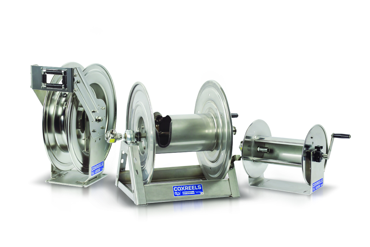 Three stainless steel industrial hose reels of different sizes with manual crank handles