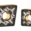 Two square carbide cutting inserts with gold coating and technical markings WMP20G and WMP30G