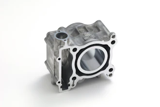 Aluminum engine cylinder head with circular bore opening and mounting bolt holes