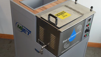Industrial ultrasonic cleaning machine with wooden top basin and control panel featuring MIET and Pro Ultrasonics branding