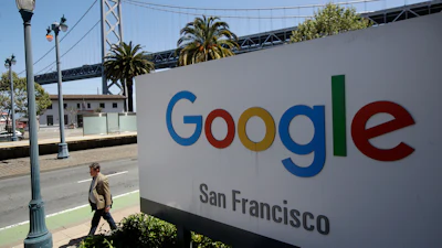 Google San Francisco sign with Bay Bridge visible in background