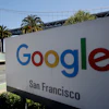 Google San Francisco sign with Bay Bridge visible in background